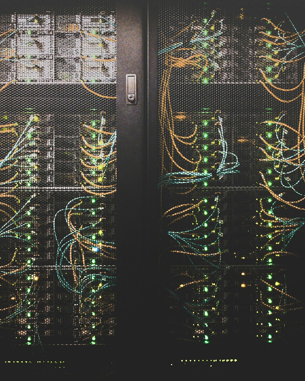 Rows of illuminated data-centre server racks